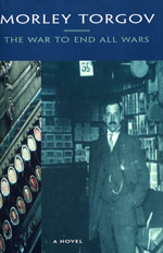 A man in a suit and tie standing next to a bunch of books.