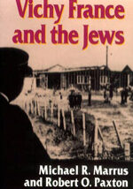 Vichy France and the Jews1 A man in uniform standing next to a fence.