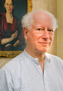 Howard Engel, 2005. A man standing in front of a painting.