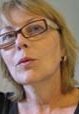 jackman_author_photo_new A woman with glasses is looking at the camera.